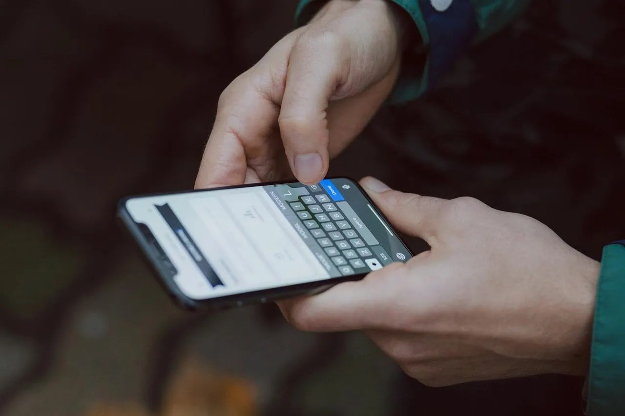 Traveller using smartphone abroad with travel eSIM connectivity and mobile data apps