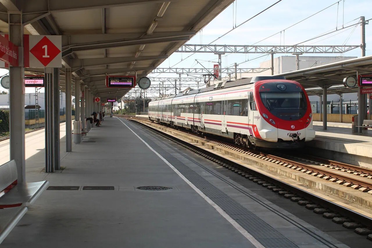 Renfe commuter train waiting at a railway station in Spain