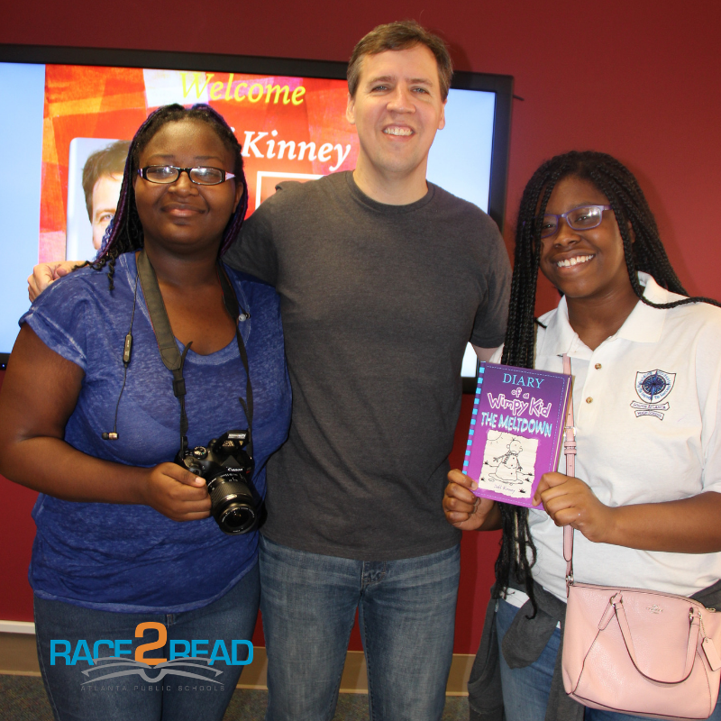 New York Times best-selling author/cartoonist Jeff Kinney with two South Atlanta High School students.