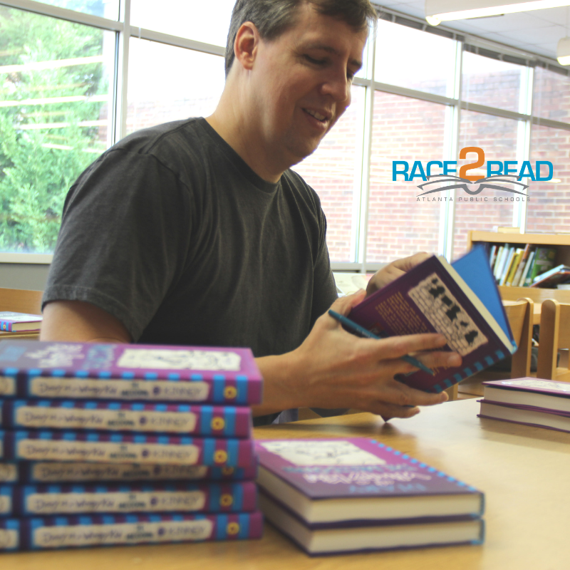 New York Times best-selling author/cartoonist Jeff Kinney’s signed nearly 500 books for APS students.