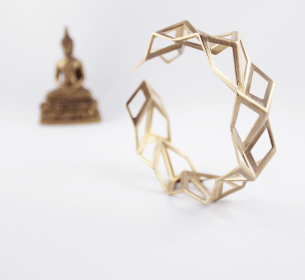 A hand-crafted, gold ring. Photo by: FoldIT Creations.