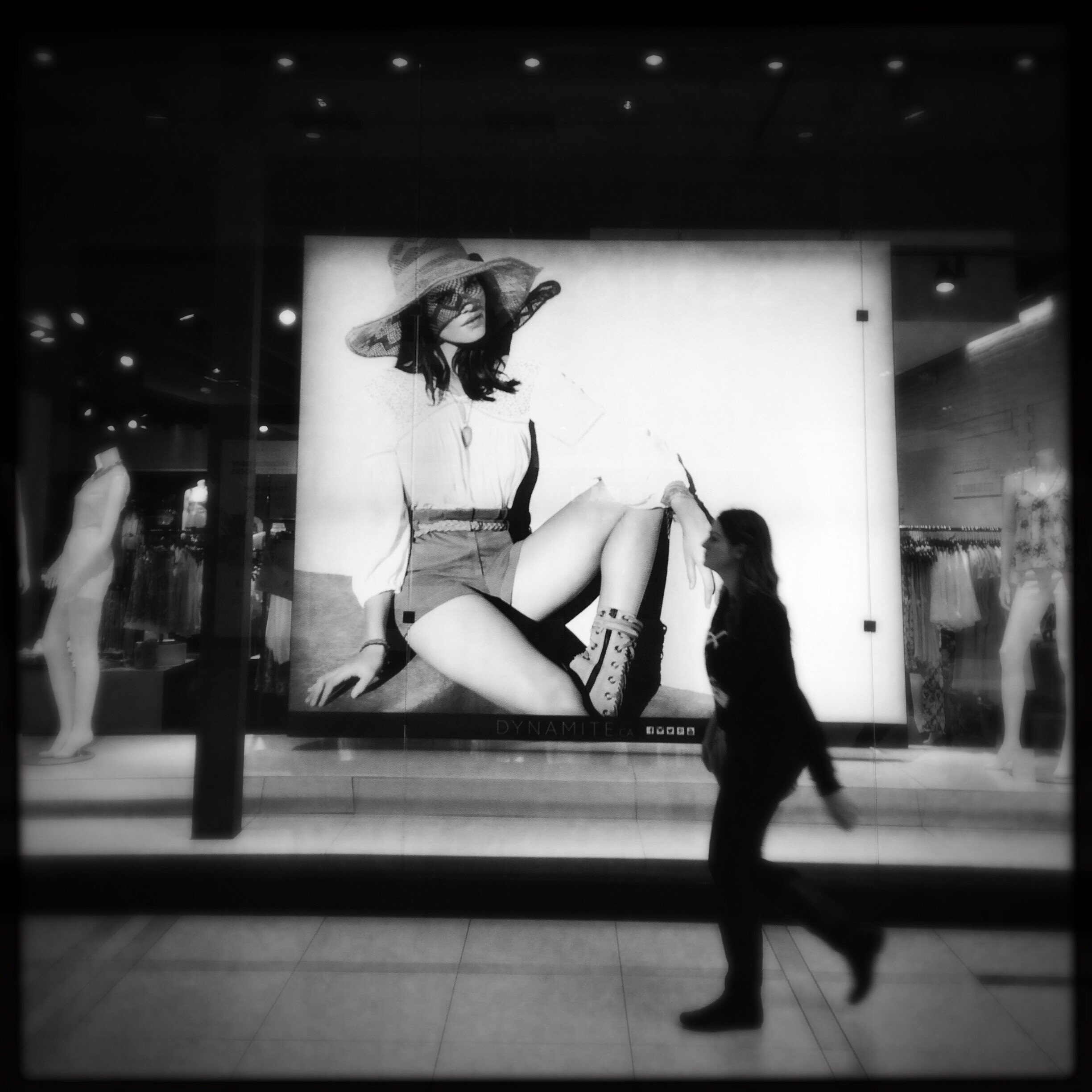 A woman walks through St.Vital Mall. Photo by: Daniel Crump. @dannyboycrump/@everydaywinnipeg
