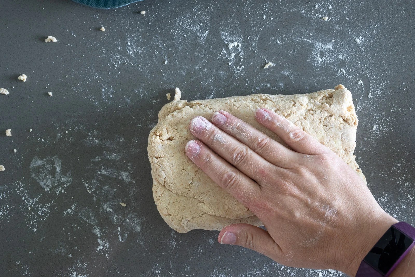 woman folding biscuits for 100% whole wheat biscuit dough.