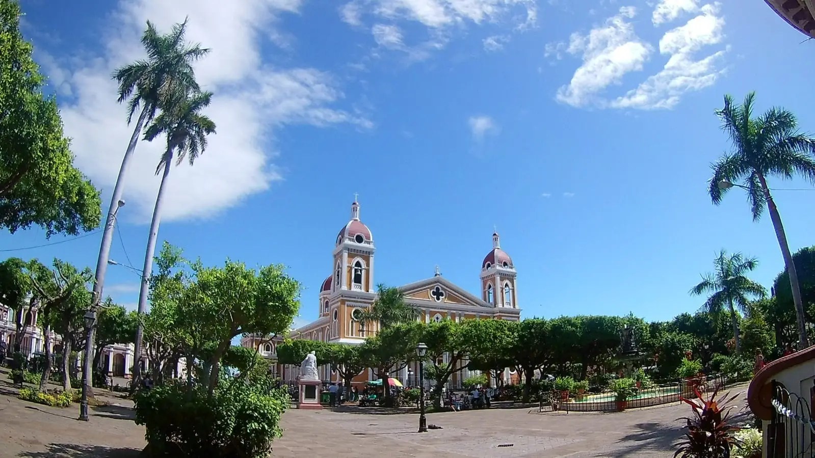 Transportation to Colorful colonial buildings in Granada Nicaragua city center.