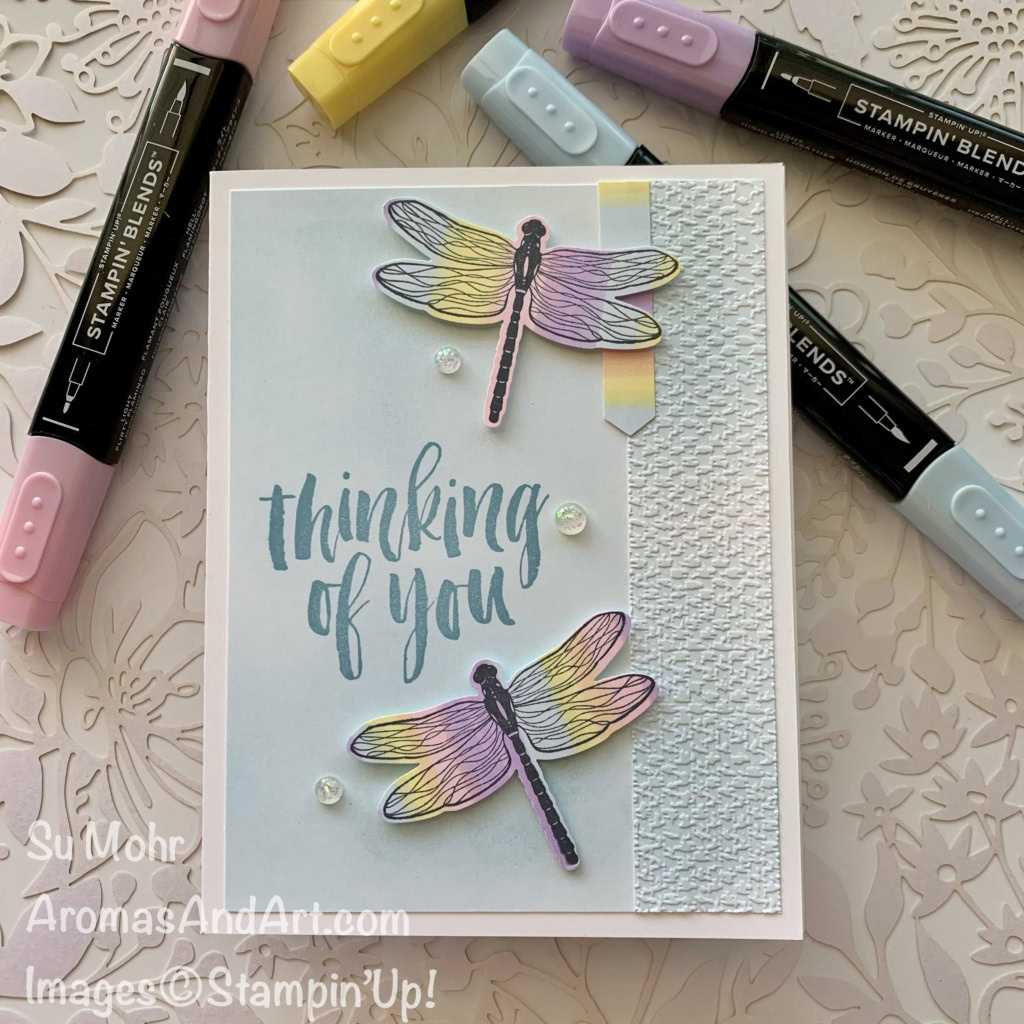 By Su Mohr for Fusion; Click aromasandart.com to go to my blog for details! Featuring: Dragonflies Bundle, Rooted In Nature, Stampin' Blends, Tasteful Textile Embossing Folder, Blending Brushes, Opal Rounds; #rainbowsoncards #rootedinnature #dragonfliesbundle #dragonflygarden #dragonflies #rainbows #handmadecards #handcrafted #diy #cardmaking #papercrafting #stamping #stampinup #cardchallenges