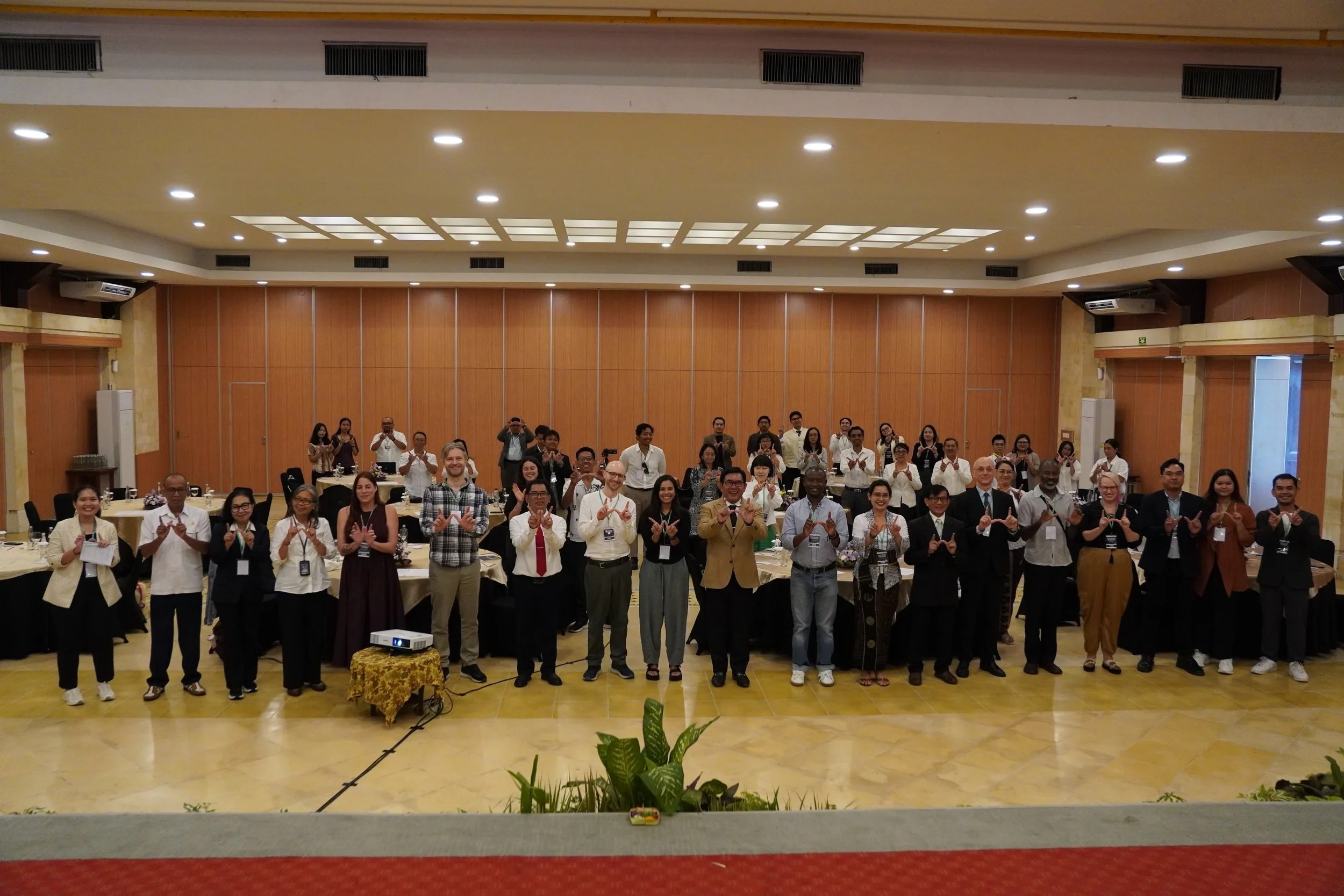 Participants and organisers at the closing of a three-day conference in Denpasar