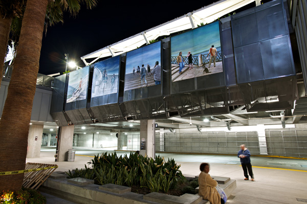 Four art panels depicting momentary encounters of people crossing paths in their daily lives.