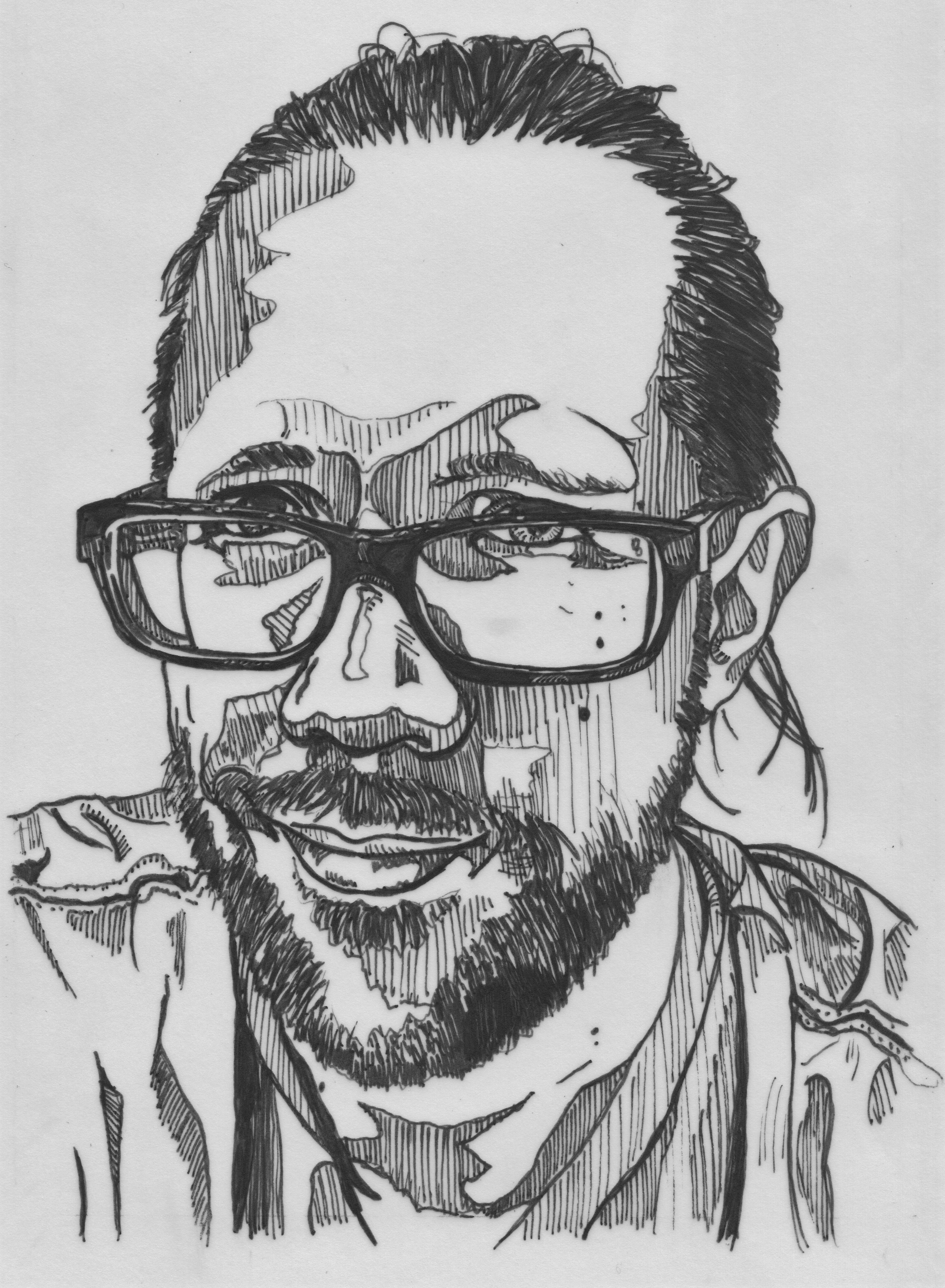 Portrait of a man with pulled back hair and glasses