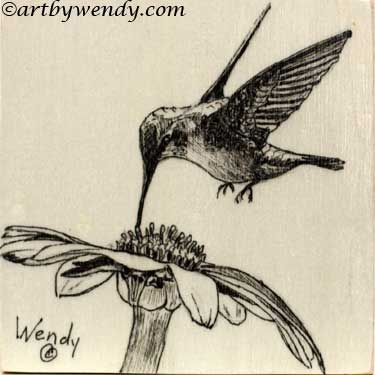 An ink drawing of a Hummingbird feeding on a flower. Ink Drawing on a 4 x 4 inch wood cradle
