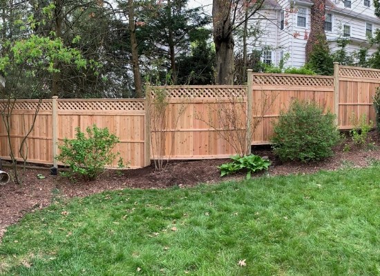 Stepped Wood privacy fence with lattice top