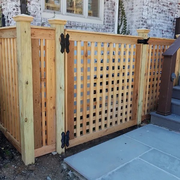Wood lattice gate and enclosure around residential property. You do need a fence permit in Bloomfield, NJ