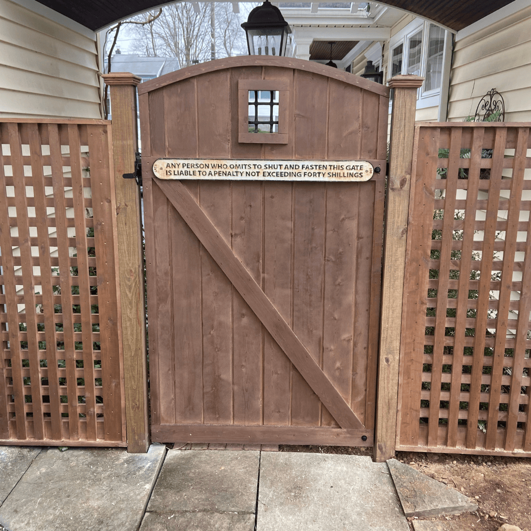 Stained wood gate and lattice fence panels
