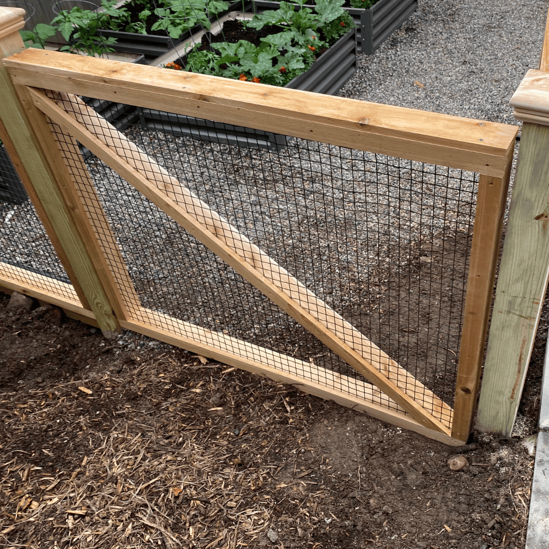 Close up of one panel of wood and wire garden fencing