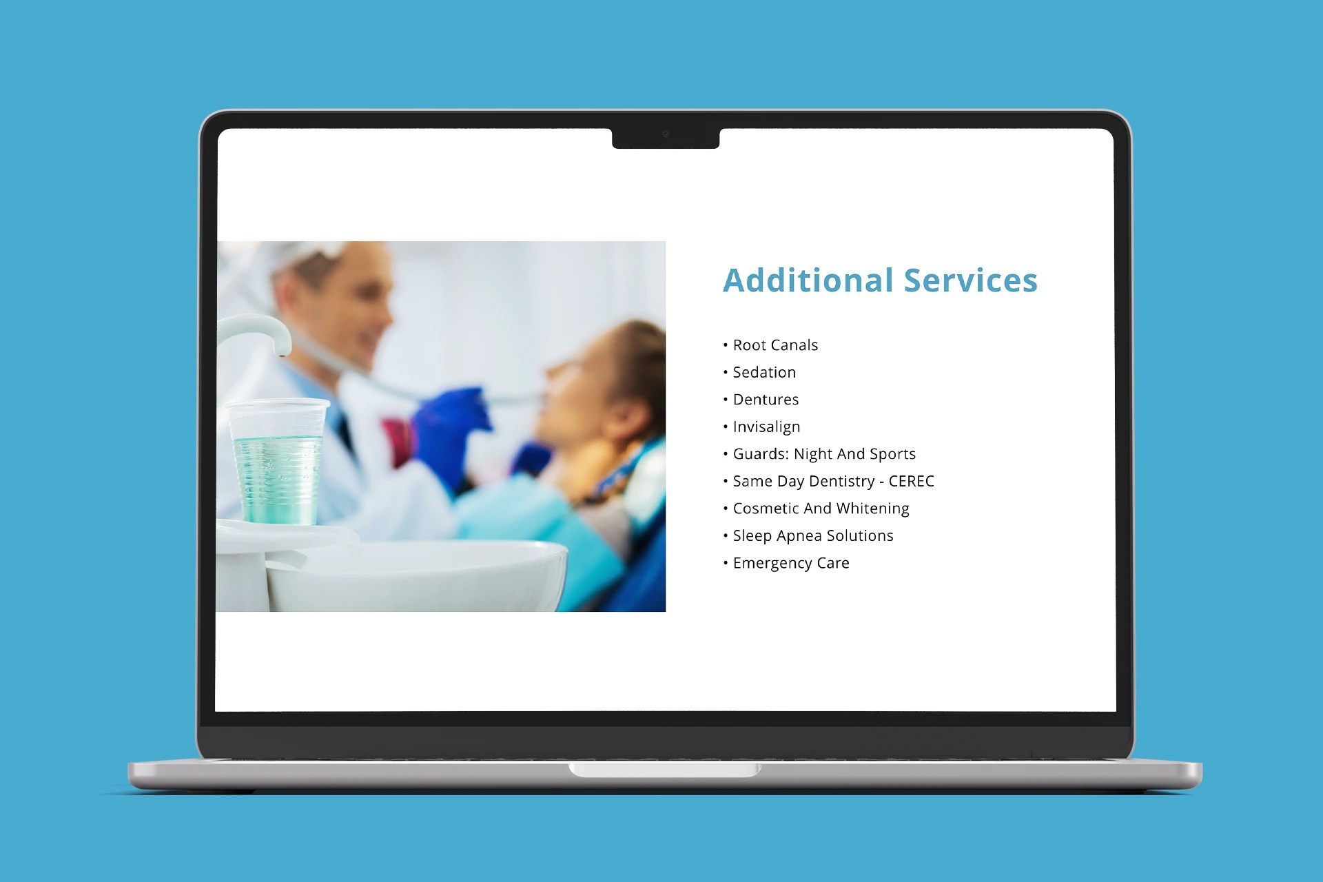 A website shown on a laptop screen of a dental clinic office.