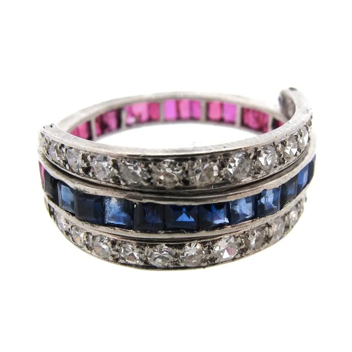 This great act deco style flip ring features a central band of calibré cut gems; Ruby Sapphire Diamond Day Night Ring A R Ullmann