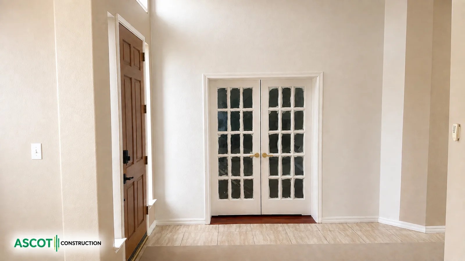 White French-style patio doors installed in a bright home interior
