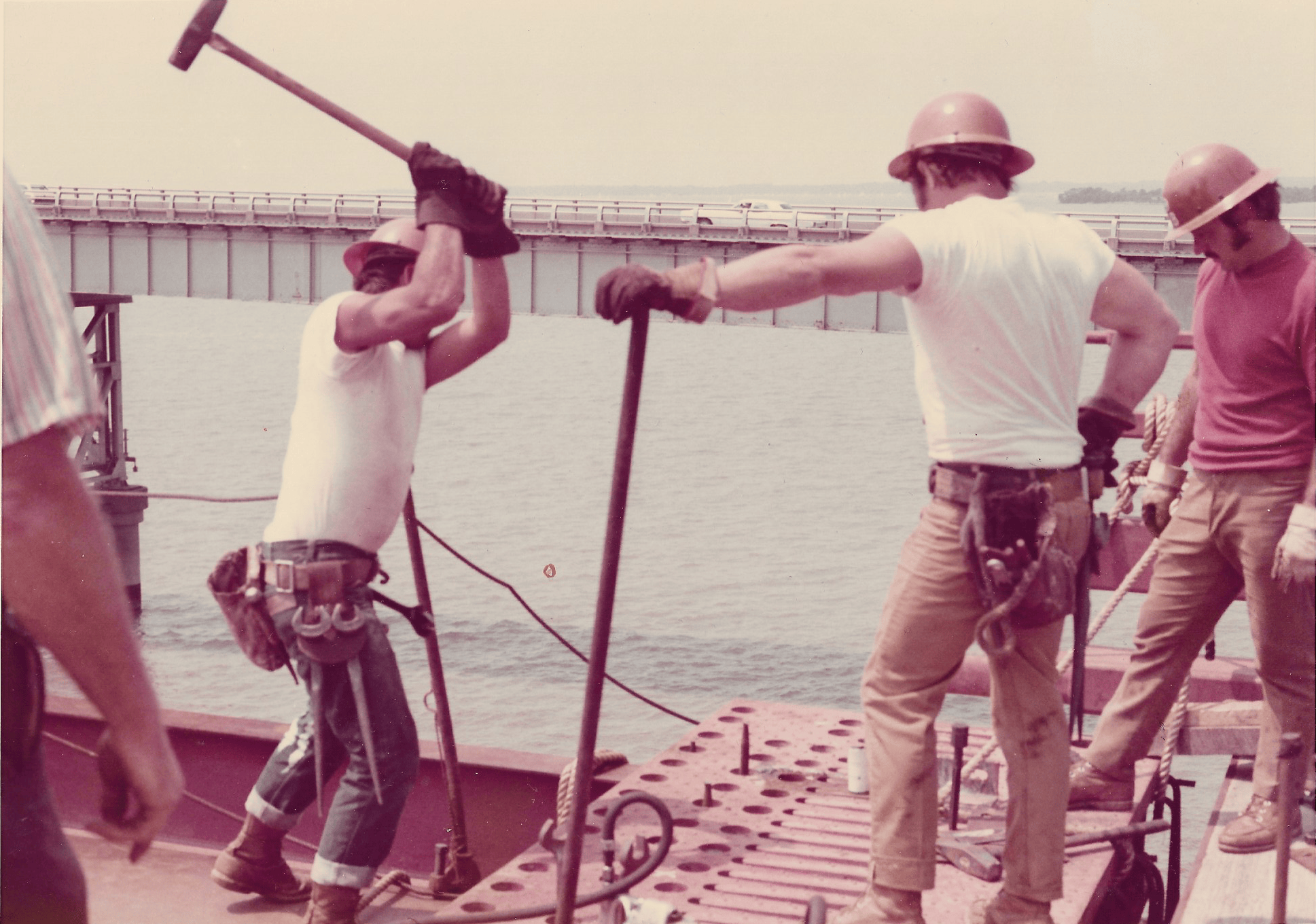 Photo of steel men on girder