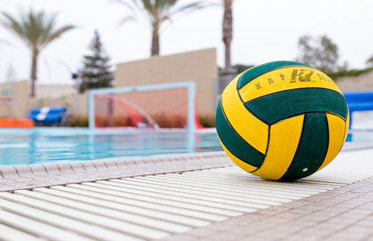 water polo ball at the edge of a pool