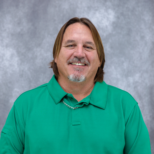 Portrait of Douglas Hayes in front of grey backdrop