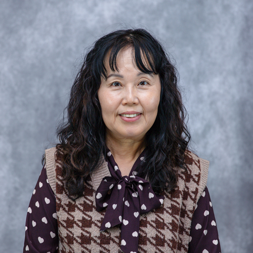Portrait of Hea-Young Moon in front of grey backdrop