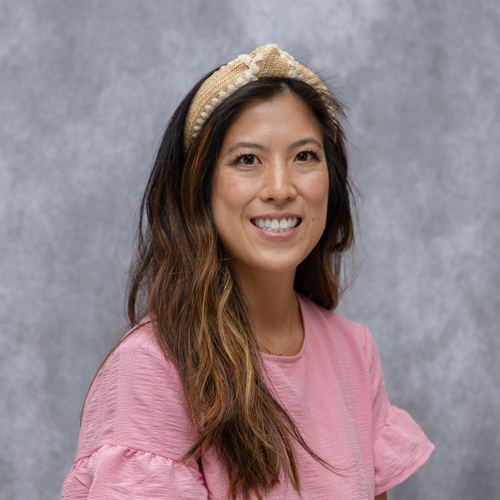 Portrait of Kaycee Martin in front of grey backdrop