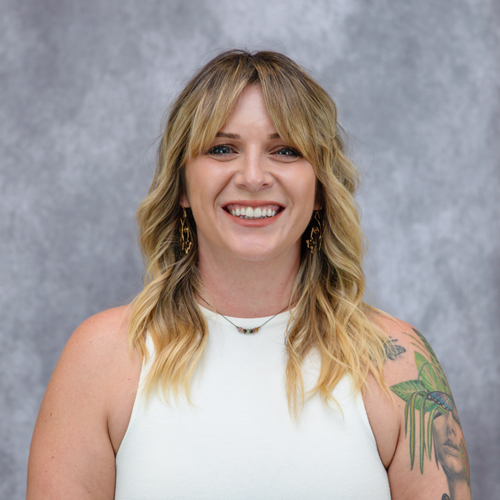 Portrait of Kylene Glisson in front of grey backdrop
