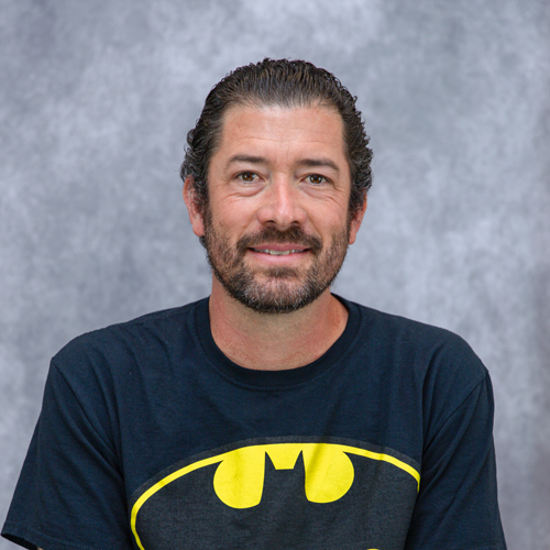 Portrait of Michael Marshall in front of grey backdrop