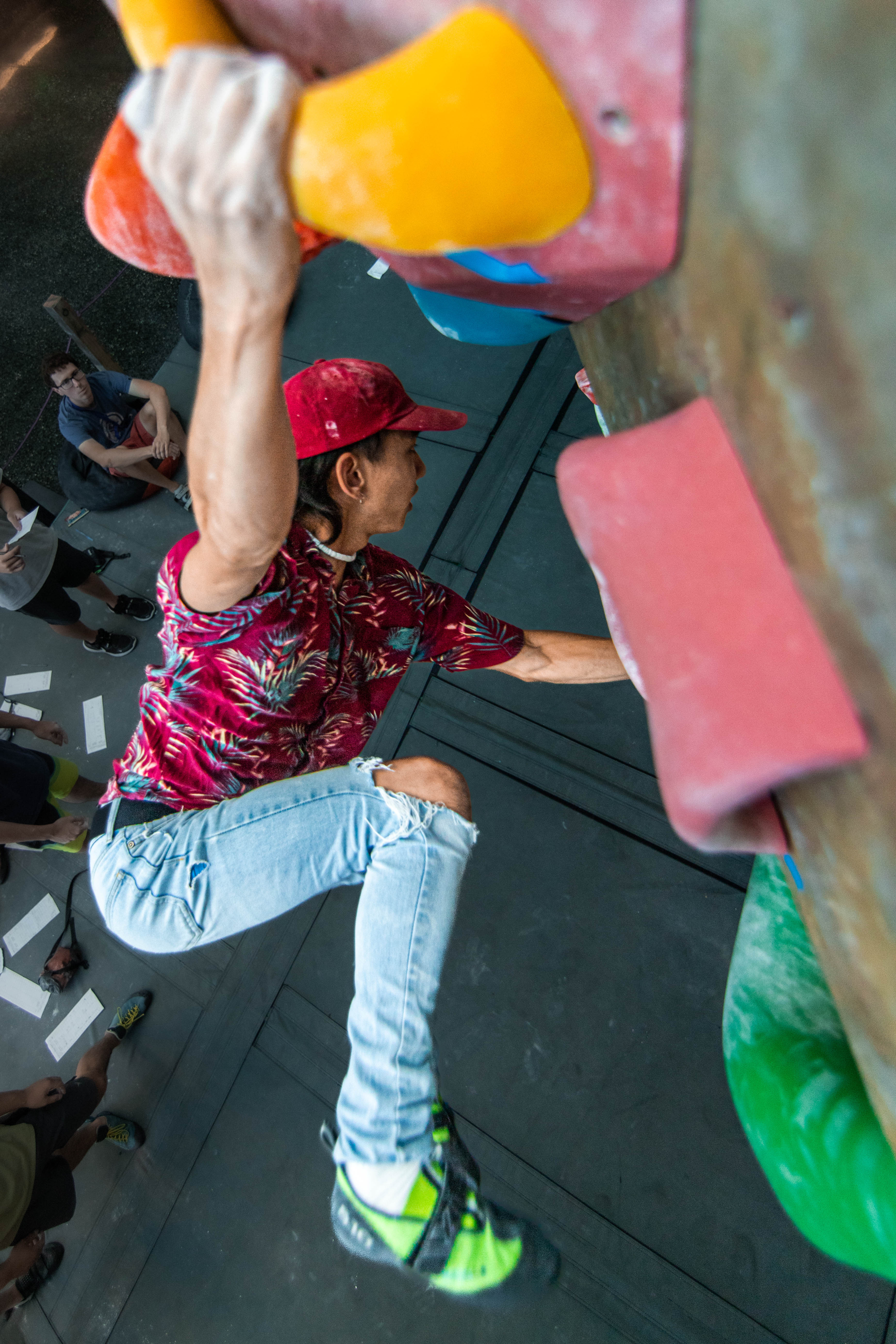 students climbing on a rock wall