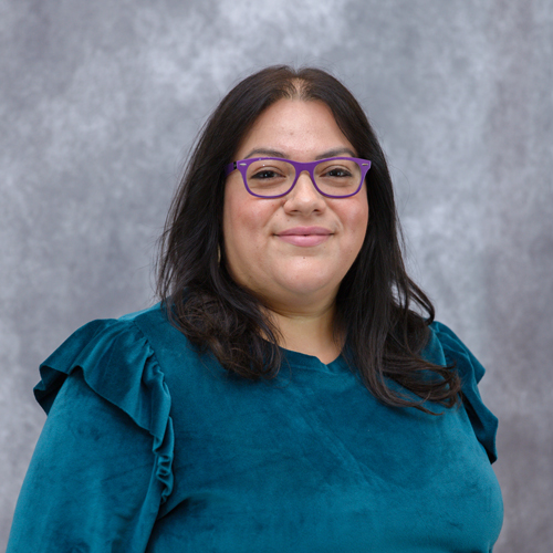 Portrait of Stacy Alarcon in front of grey backdrop