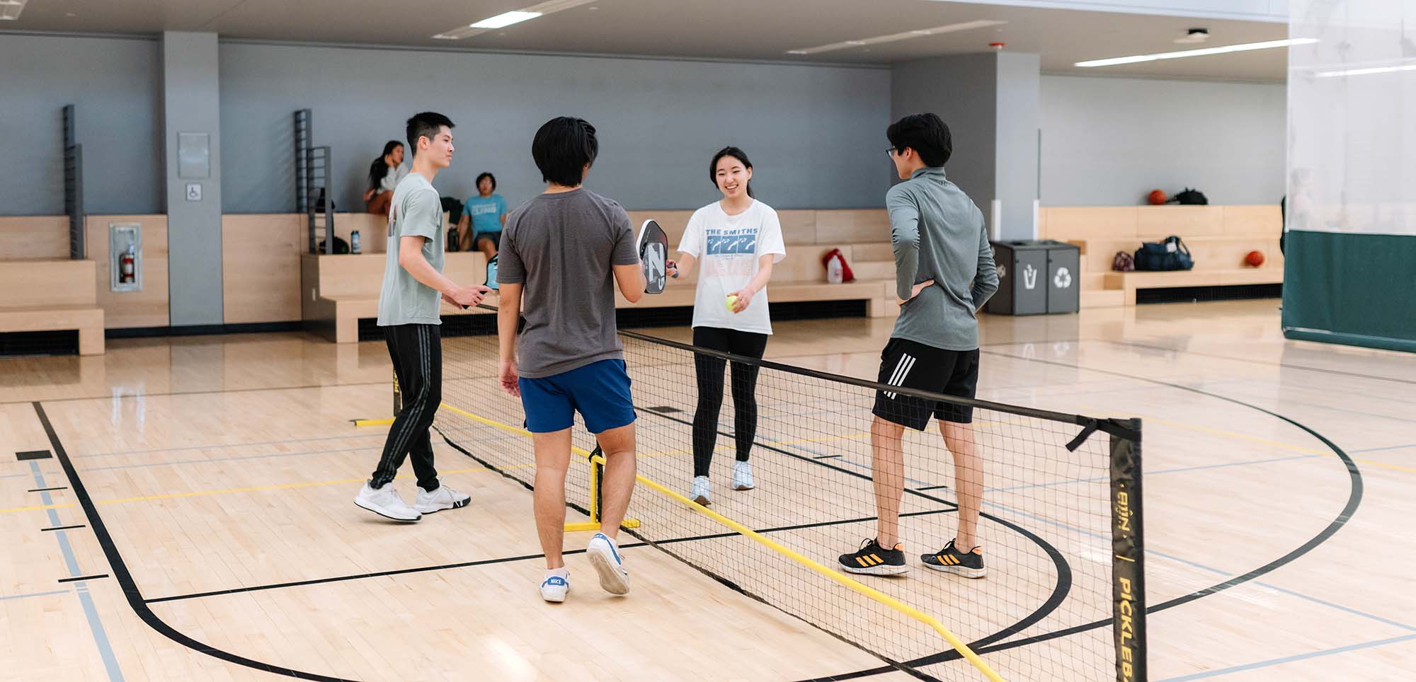 Students playing in a pickleball tournament