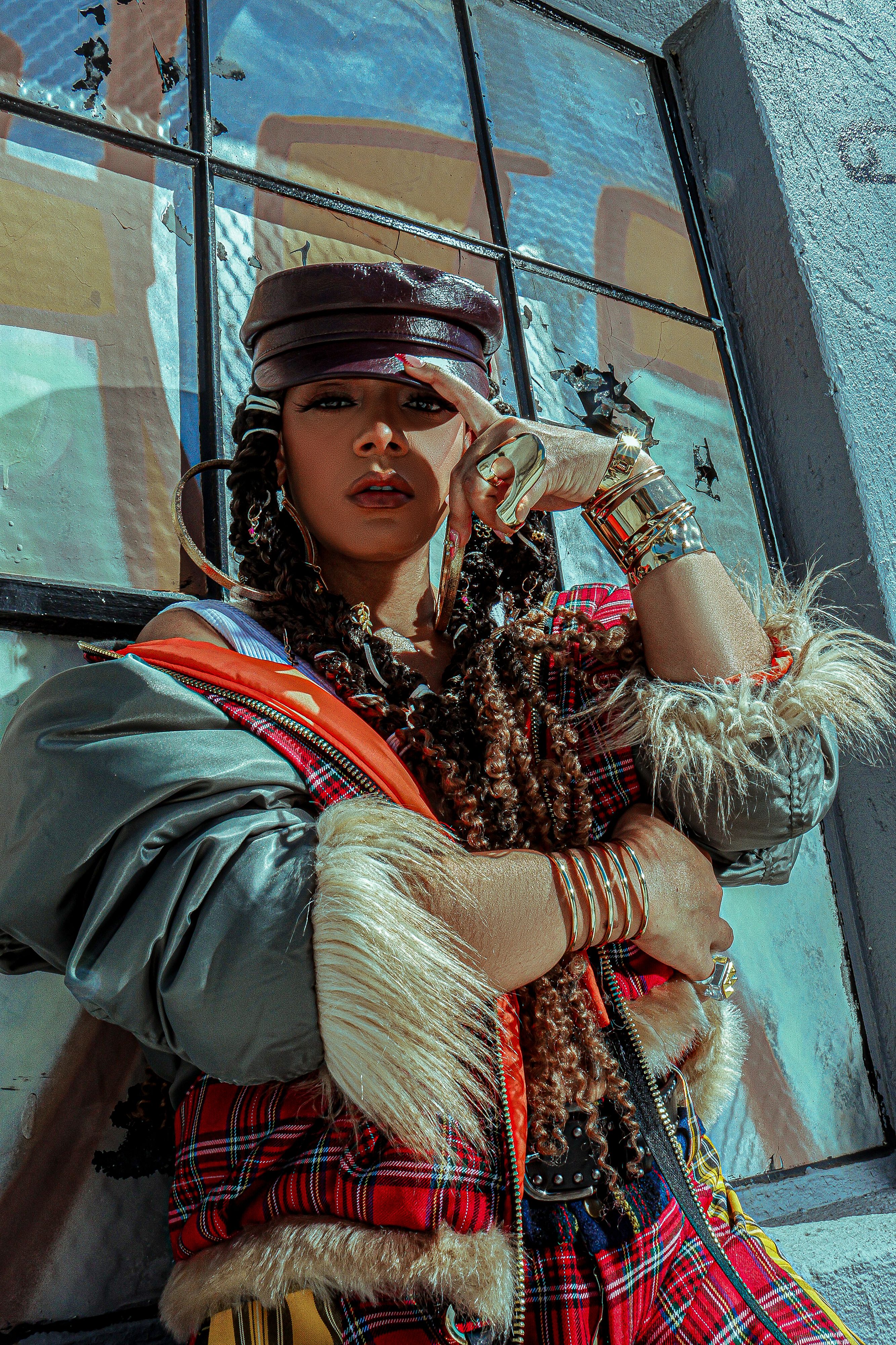 La Gabi posing in a scarf and hat