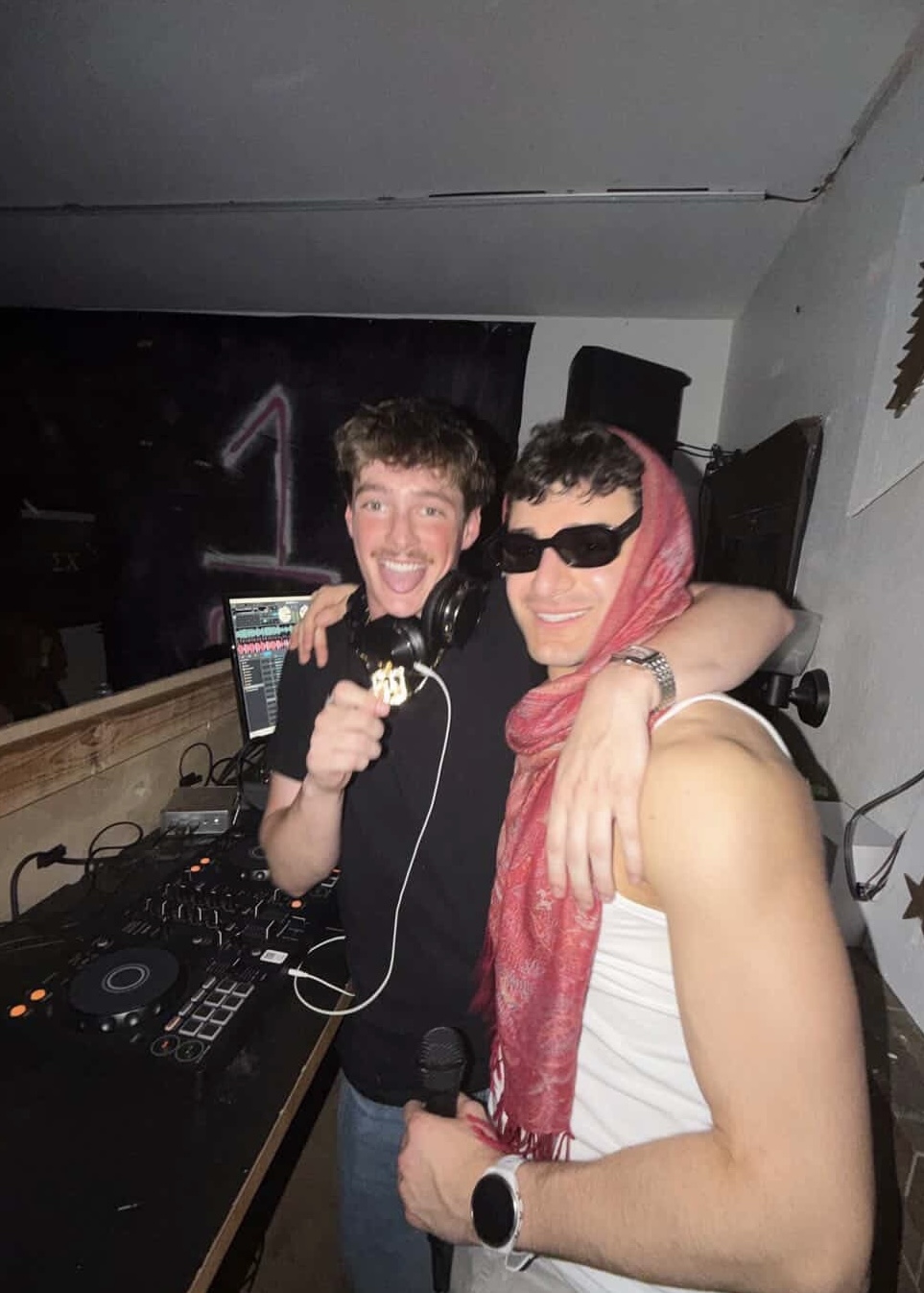 Two males smiling at photo