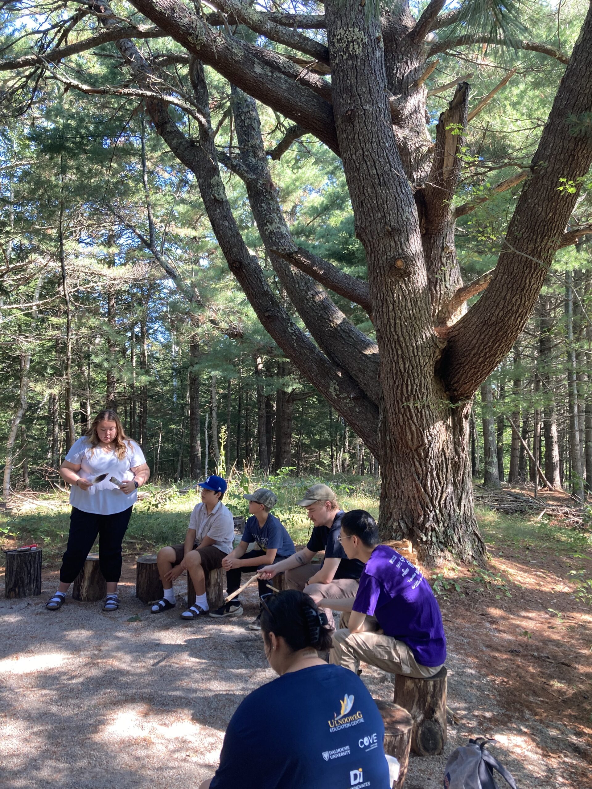 Youth around a fire circle