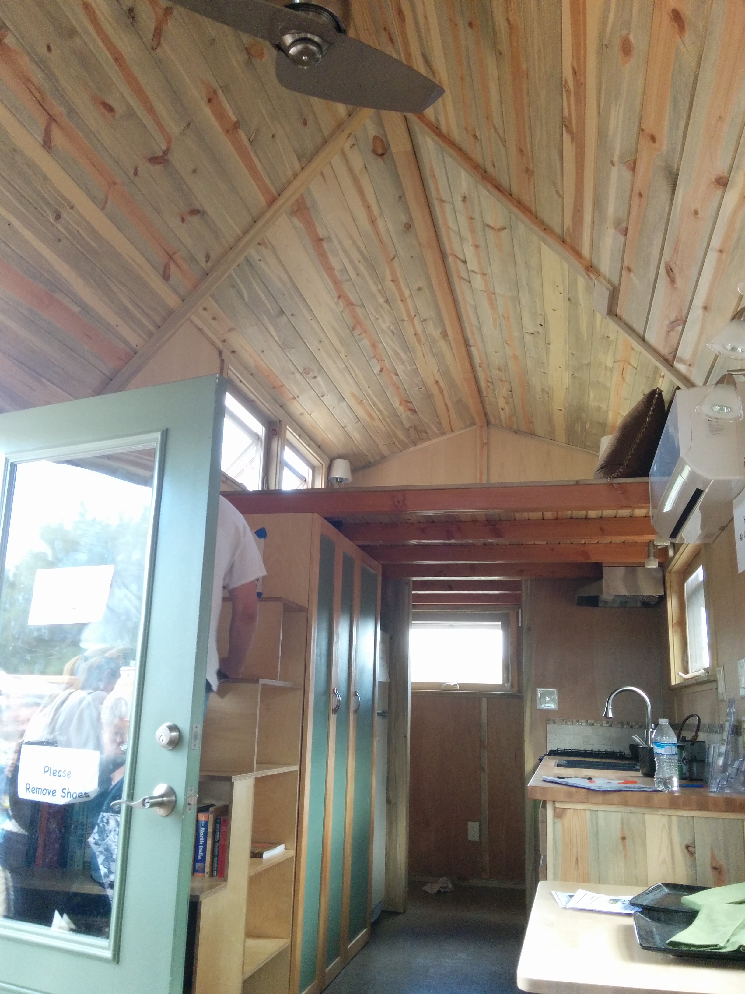 Stairs and storage opposite the kitchen.