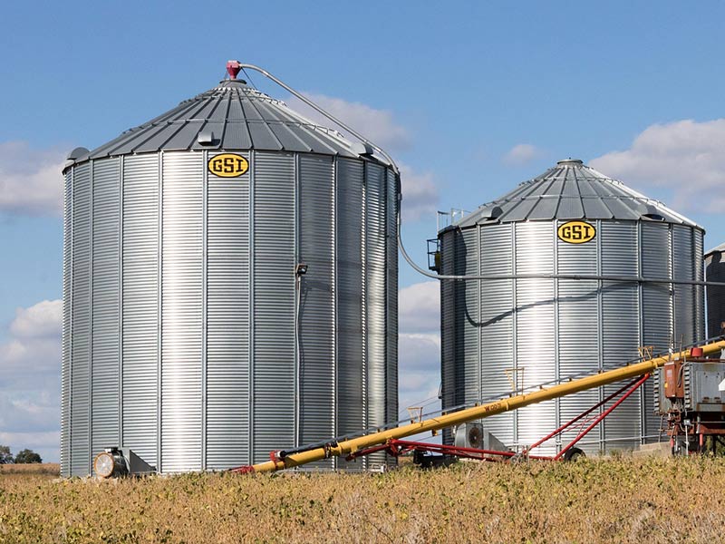 Metal grain silos used for grain drying and storage on a farm