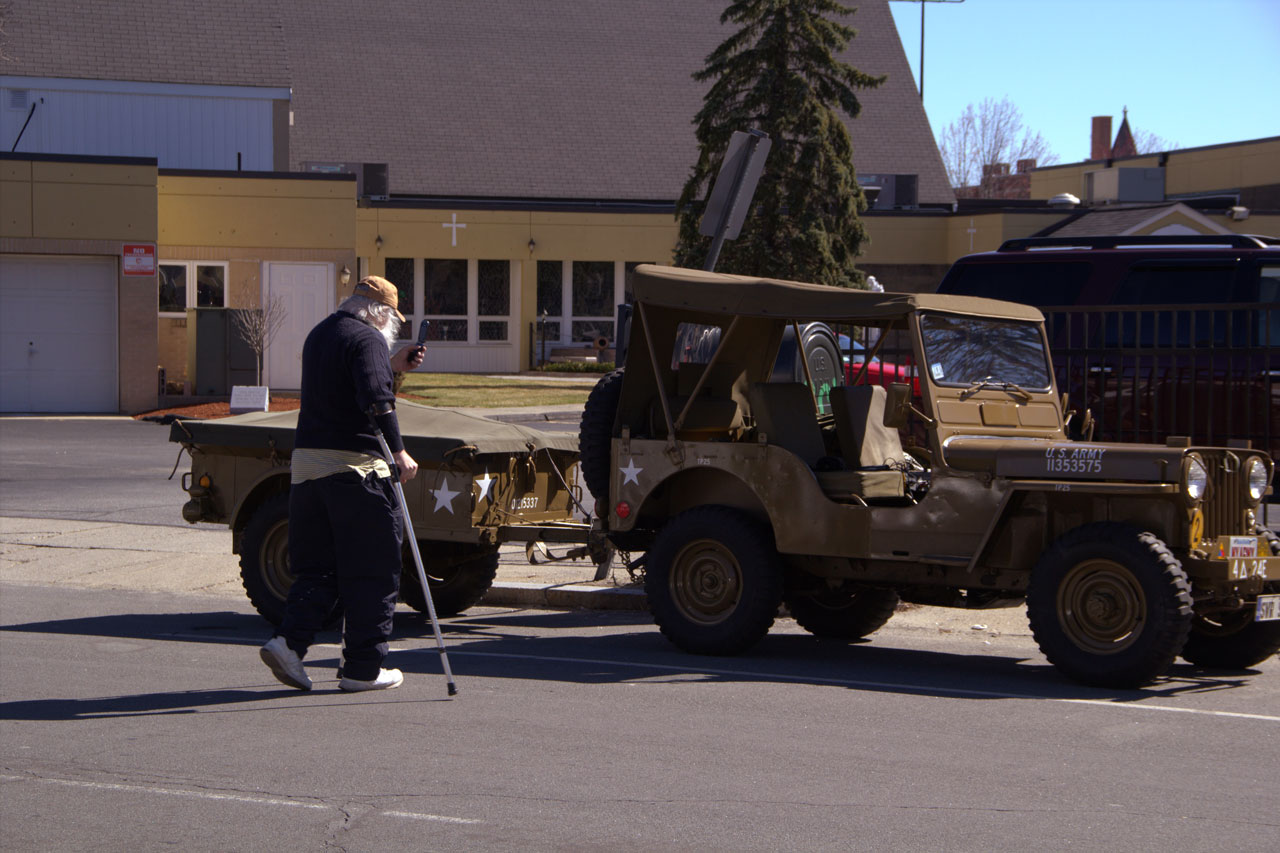 Woody inspects an army jeep