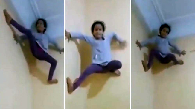 স্পাইডাৰমেন’ নহয় ‘স্পাইডাৰ চাইল্ড’! পিছফালেৰে দেৱালত উঠা কণমানিৰ ভিডিও ভাইৰেল