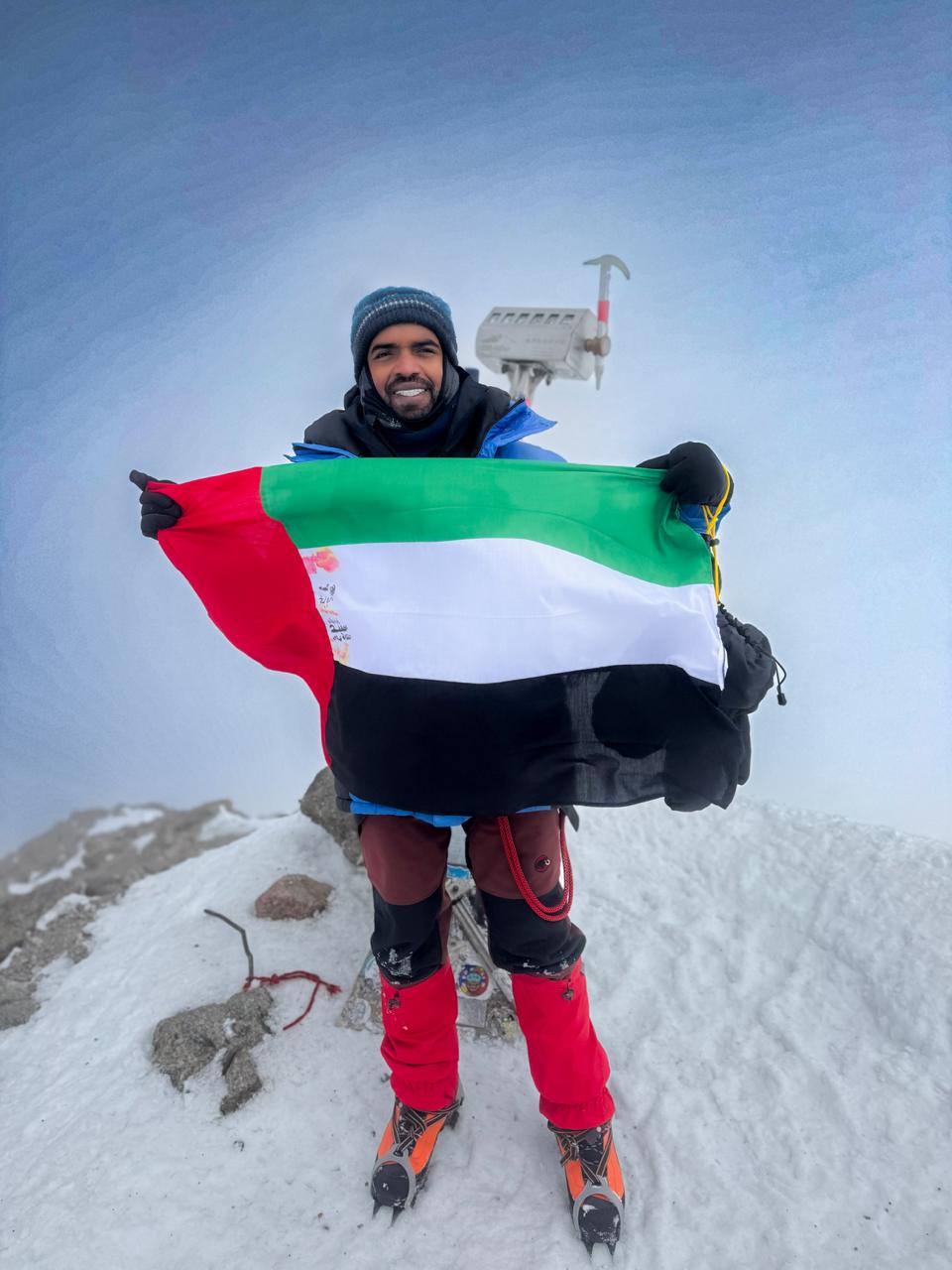 Rashid Al Shamsi raises the UAE flag on the highest summit in Europe