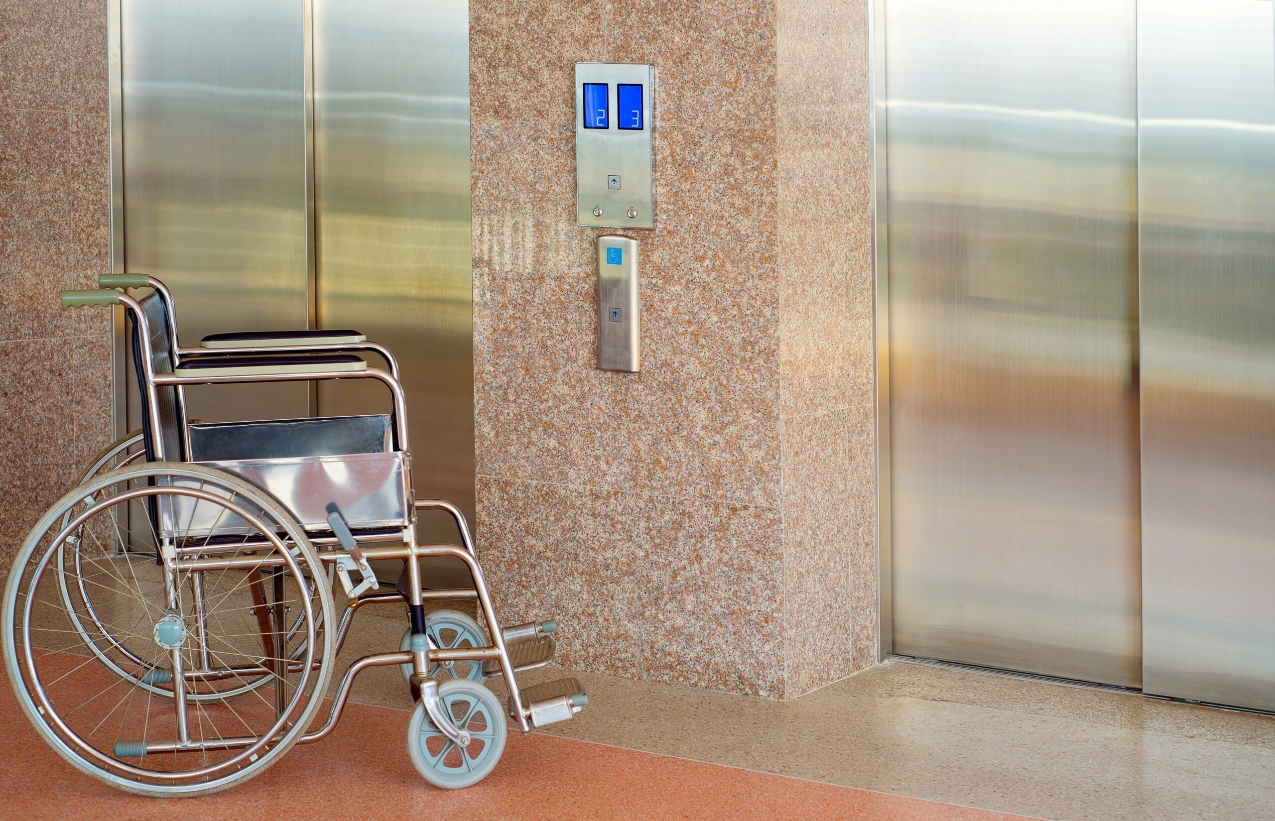 Wheelchair and elevator for disabled, wheelchair waiting in fron