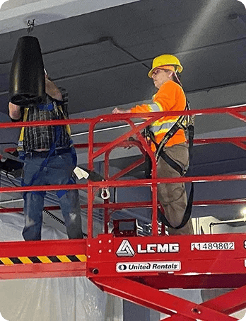 AIS technicians installing commercial audio equipment
