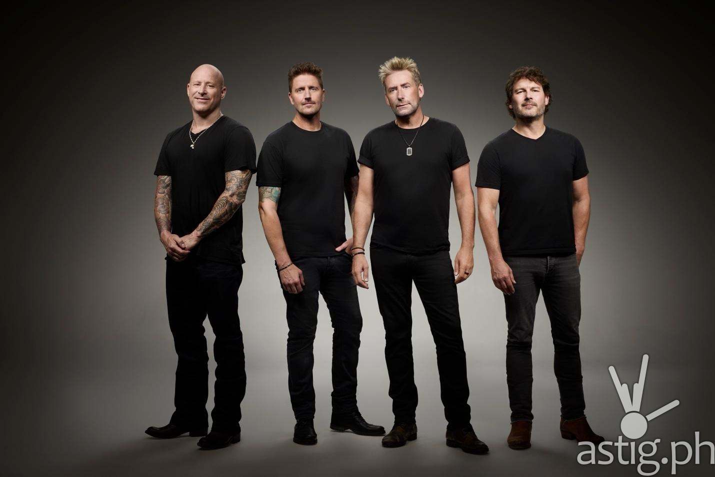 Nickelback band members in a studio portrait