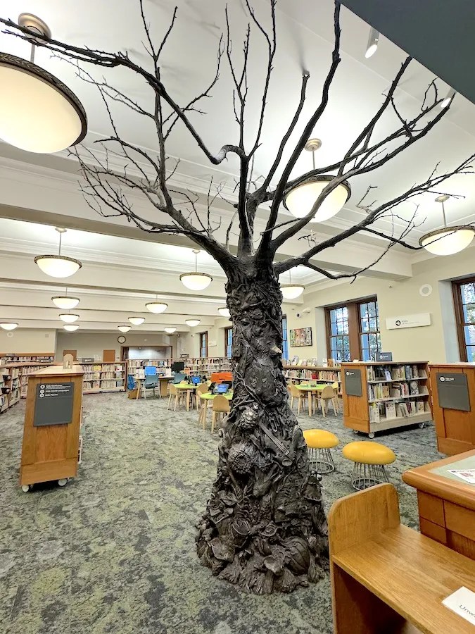 Sculpture of tree, trunk of story elements