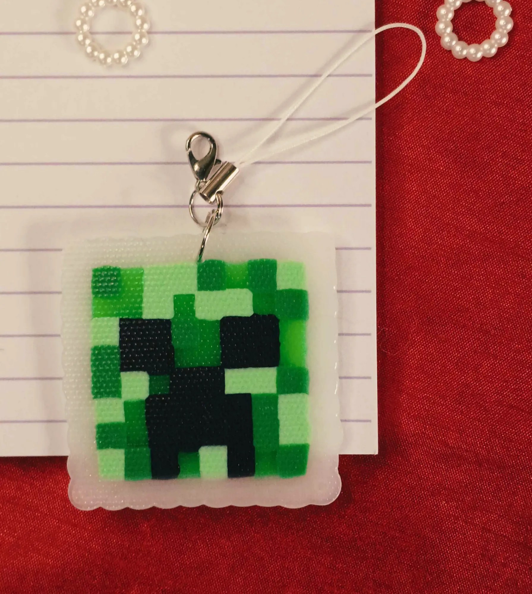 Display of Handcrafted Gaming Icon Phone & Bag Charm