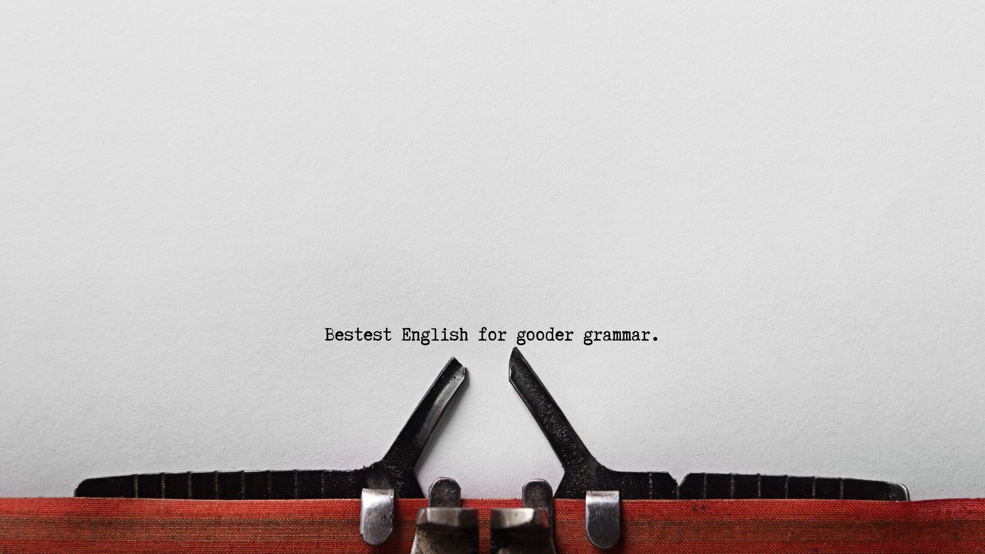 Close-up of the phrase 'Bestest English for Gooder Grammar' humorously illustrating common writing mistakes in business communication.