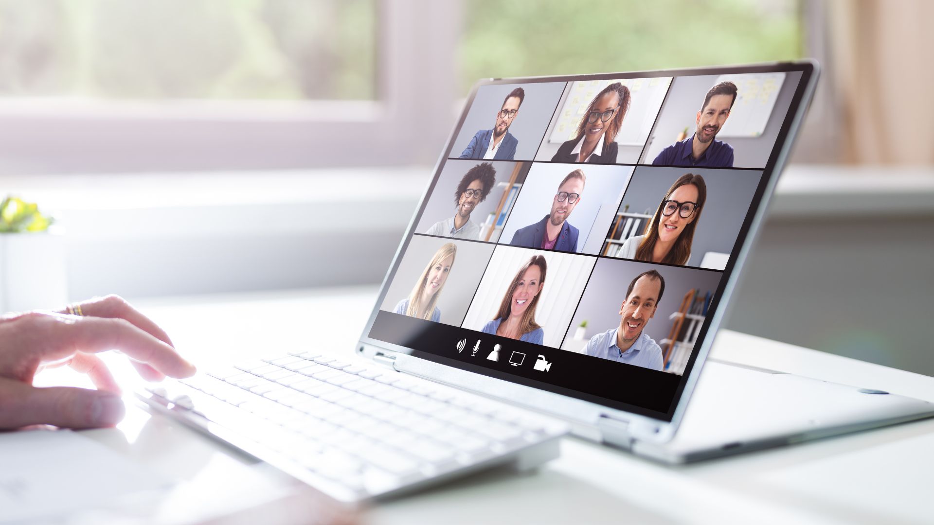 A group meeting with a laptop, symbolizing workplace training and team collaboration in the professional environment.