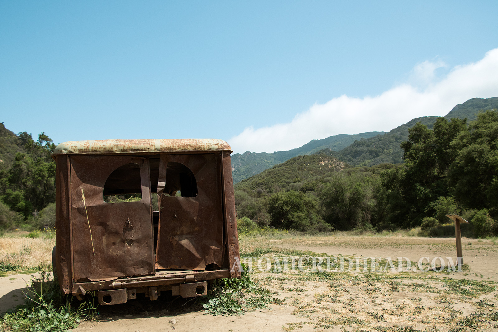 The back of the old ambulance with the hills in the background.