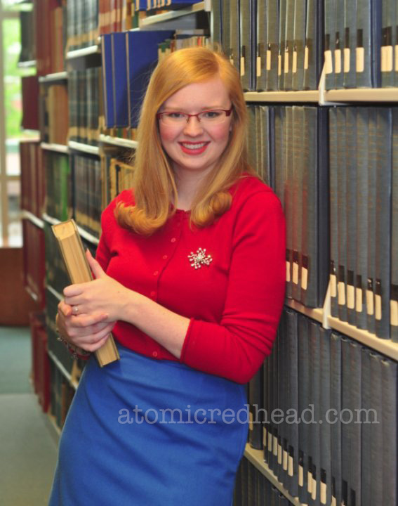 My college graduation photo - a red sweater from Target and a vintage blue pencil skirt and a vintage rhinestone brooch.