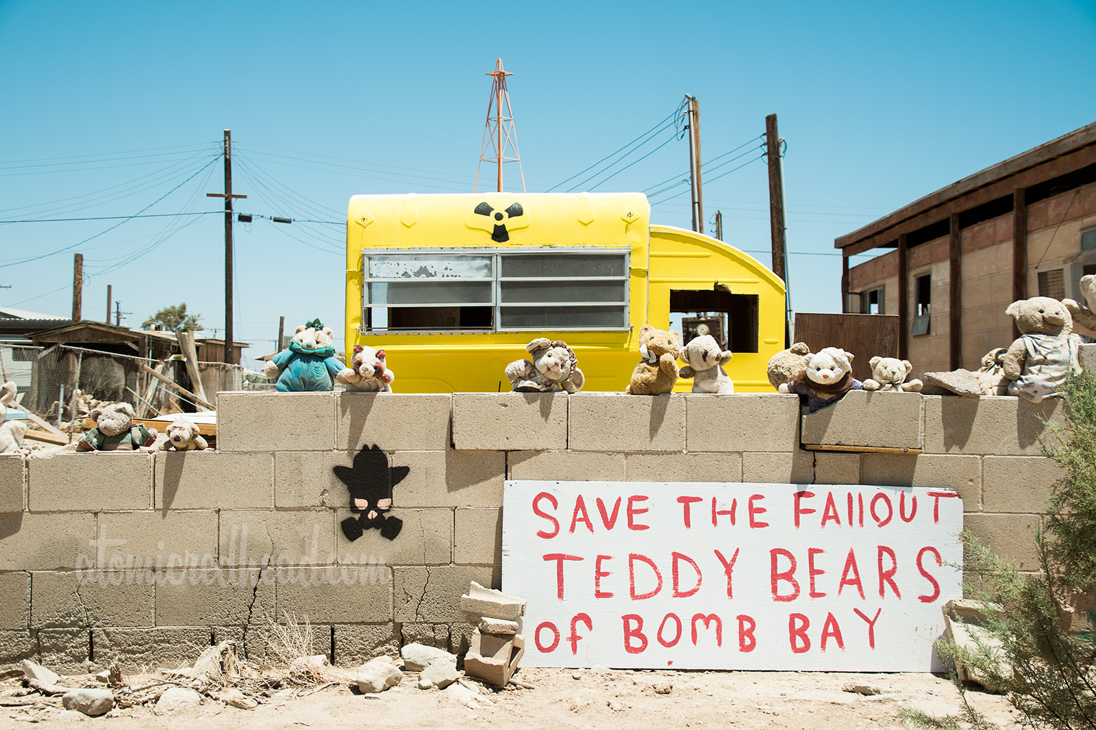 Art Instillation: Save the Fallout Teddy Bears of Bomb Bay - teddy bears and a trailer painted yellow with nuclear waste symbol