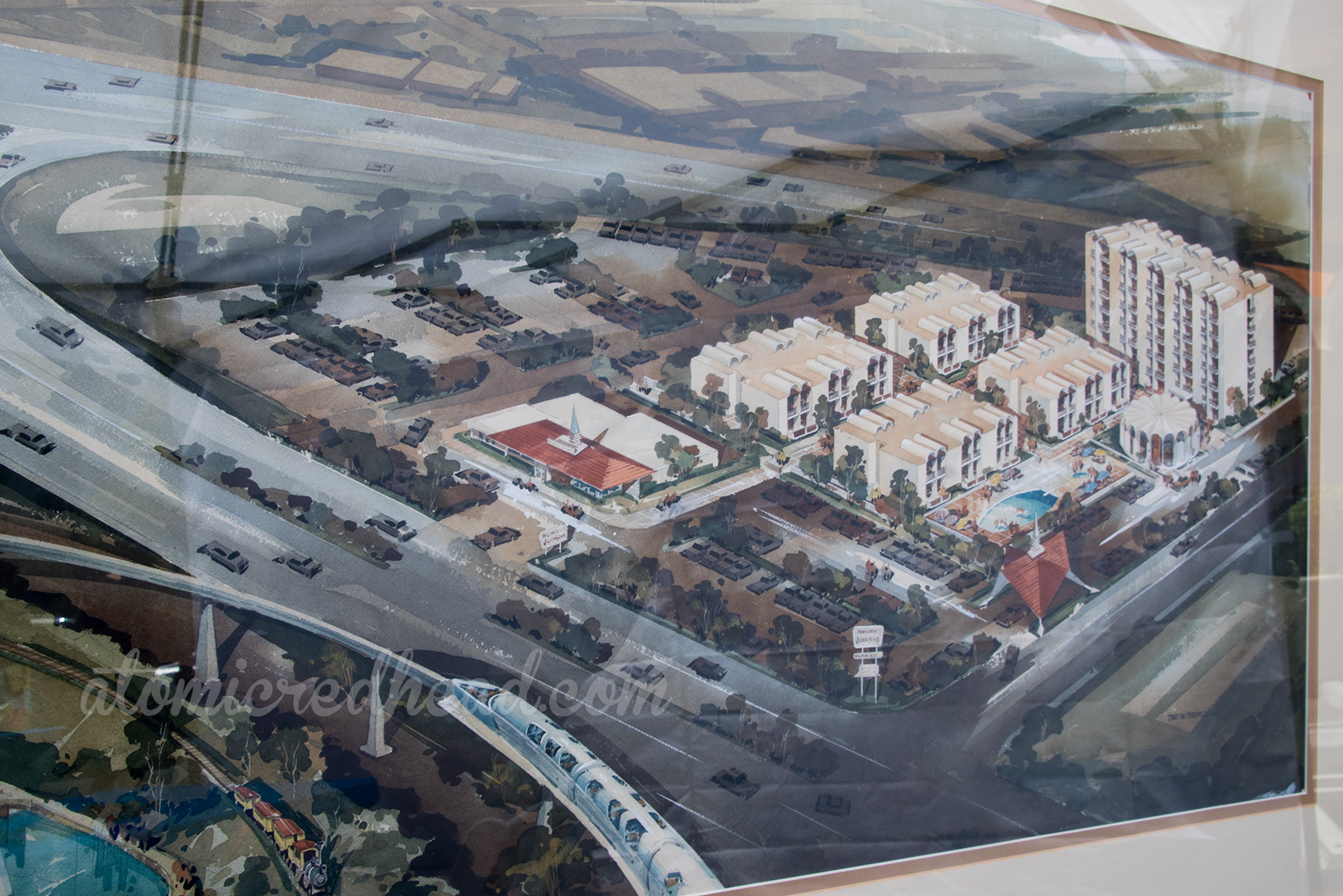 Concept art for the Anaheim HoJo, with several mid-century buildings, and Disneyland peeking out of the lower left corner.