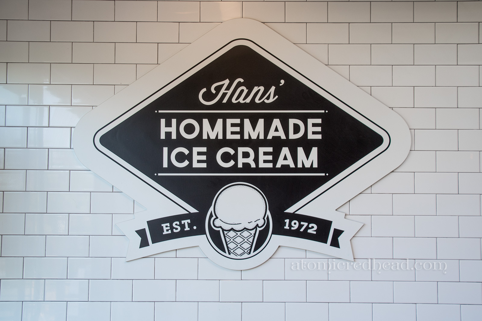 Hans' Homemade Ice Cream sign, black and white, established in 1972.